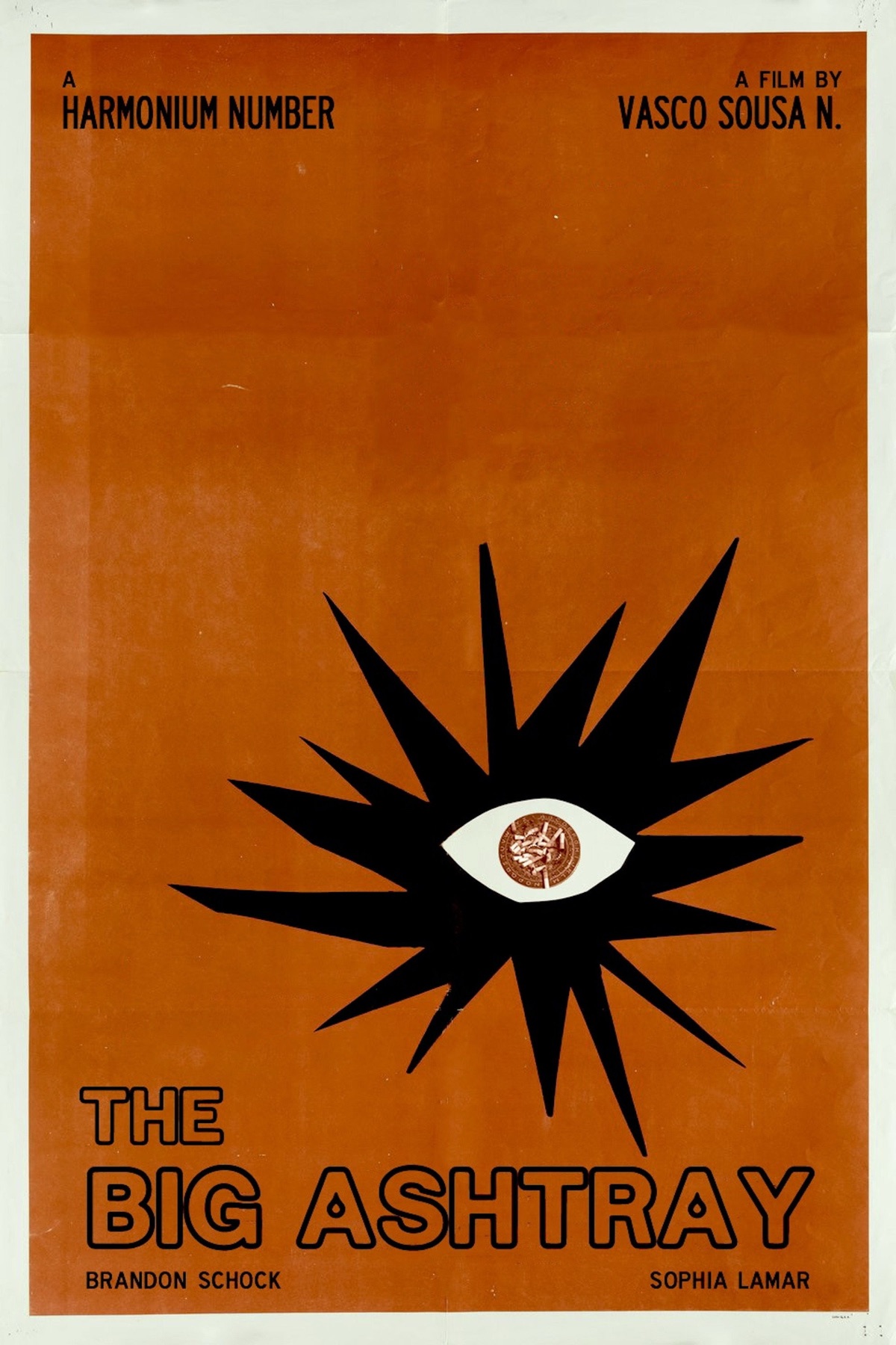 Poster for The Big Ashtray: A Harmonium Number, a film by Vasco Sousa N., starring Brandon Schock and Sophia Lamar. A black starburst with an eye, an ashtray full of cigarette butts as its pupil, on a burnt-orange background.